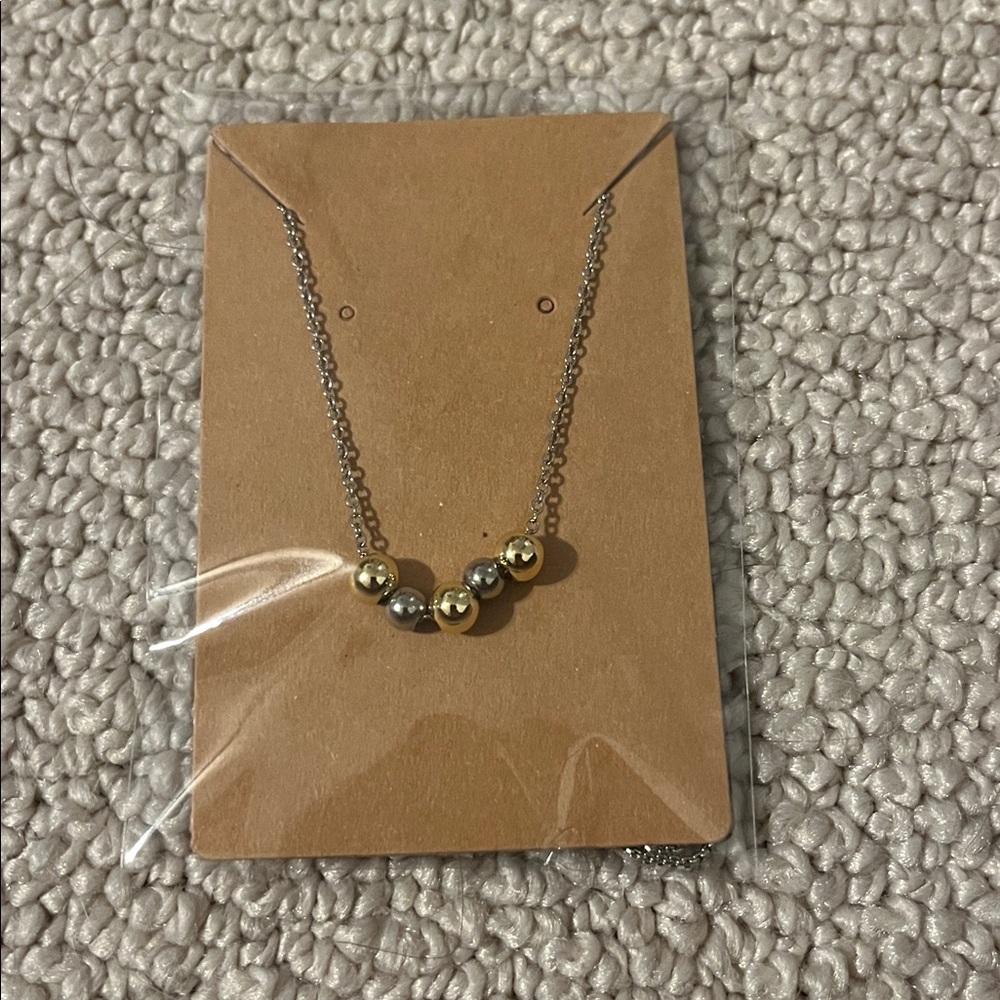 Elegant Silver and Gold Bead Necklace